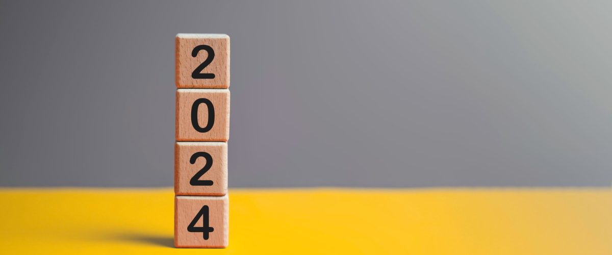 2024 New year goal planning idea concept, number in wooden block cubes. Gray and yellow background with copy space.